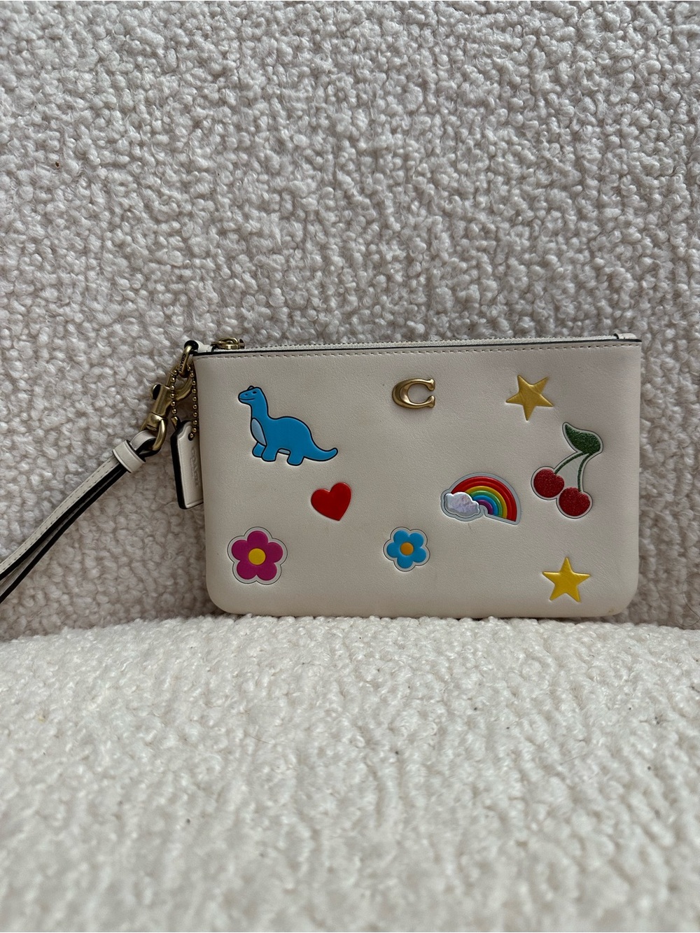 Coach Cream Wristlet with Colorful Sticker Motifs